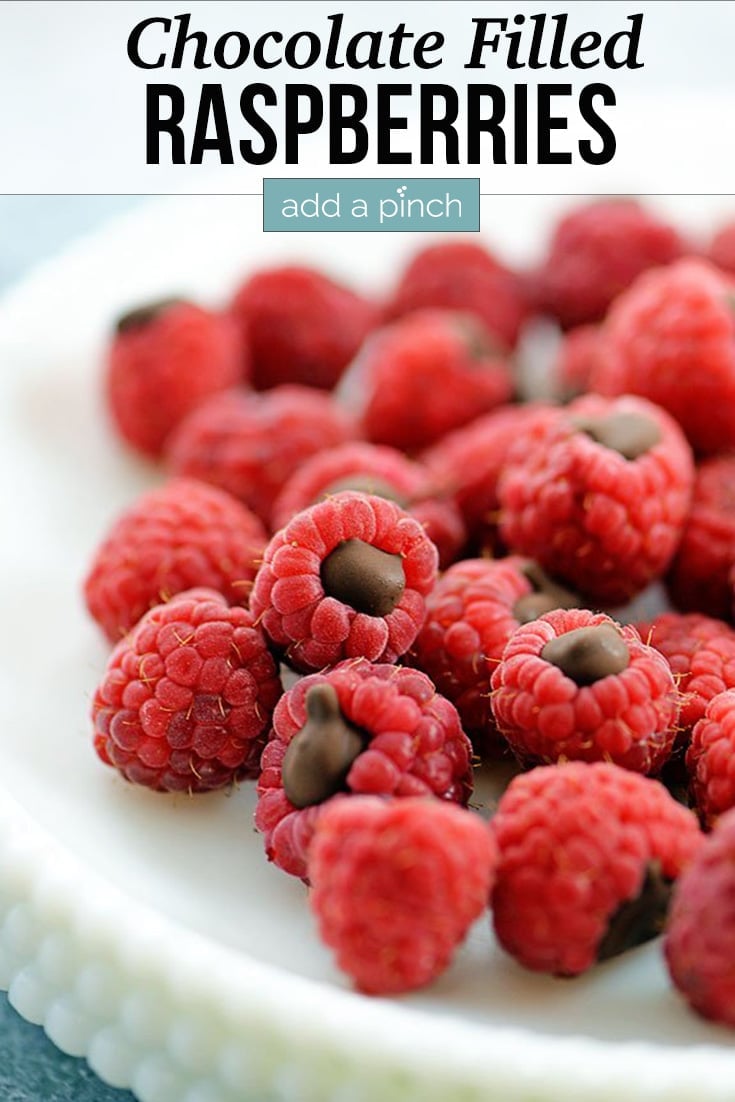 Chocolate Filled Raspberries on white dish - with text - addapinch.com