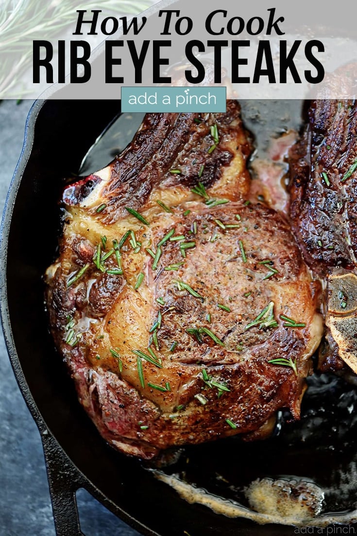 Skillet Rib Eye Steaks basted in butter topped with rosemary - with text - addapinch.com