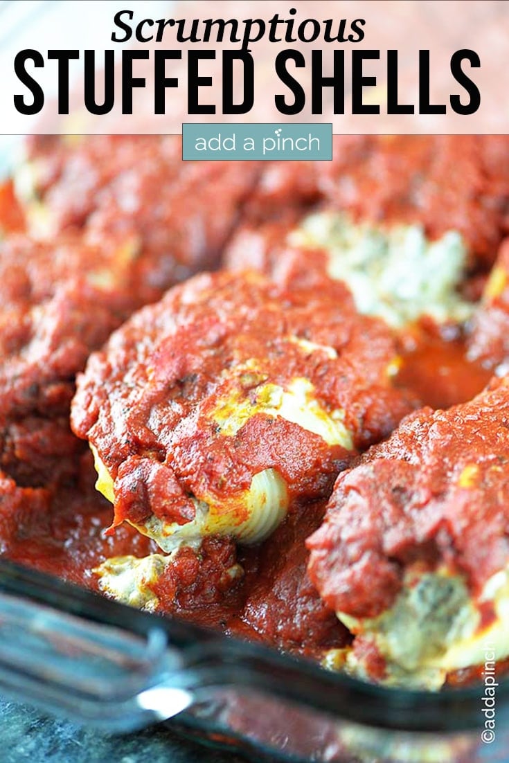 Stuffed Shells covered in tomato sauce - with text - addapinch.com