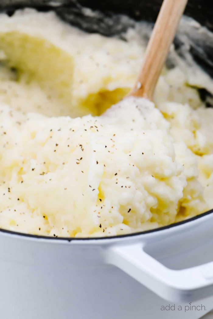 Easy Mashed Potatoes Recipe - These are truly the perfect mashed potatoes! Buttery, creamy, fluffy and absolutely delicious, they are so easy to make and always a family favorite! // addapinch.com