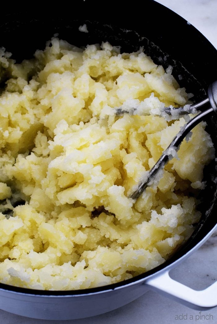 Easy Mashed Potatoes Recipe - These are truly the perfect mashed potatoes! Buttery, creamy, fluffy and absolutely delicious, they are so easy to make and always a family favorite! // addapinch.com