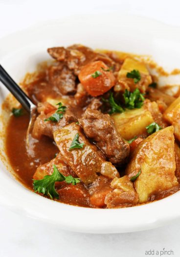 The Best Instant Pot Beef Stew Recipe - Mouthwatering beef stew made with tender chunks of beef, delicious vegetables and a hearty broth makes a favorite Instant Pot recipe! // addapinch.com