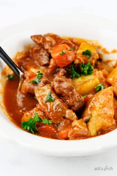 The Best Instant Pot Beef Stew Recipe - Mouthwatering beef stew made with tender chunks of beef, delicious vegetables and a hearty broth makes a favorite Instant Pot recipe! // addapinch.com