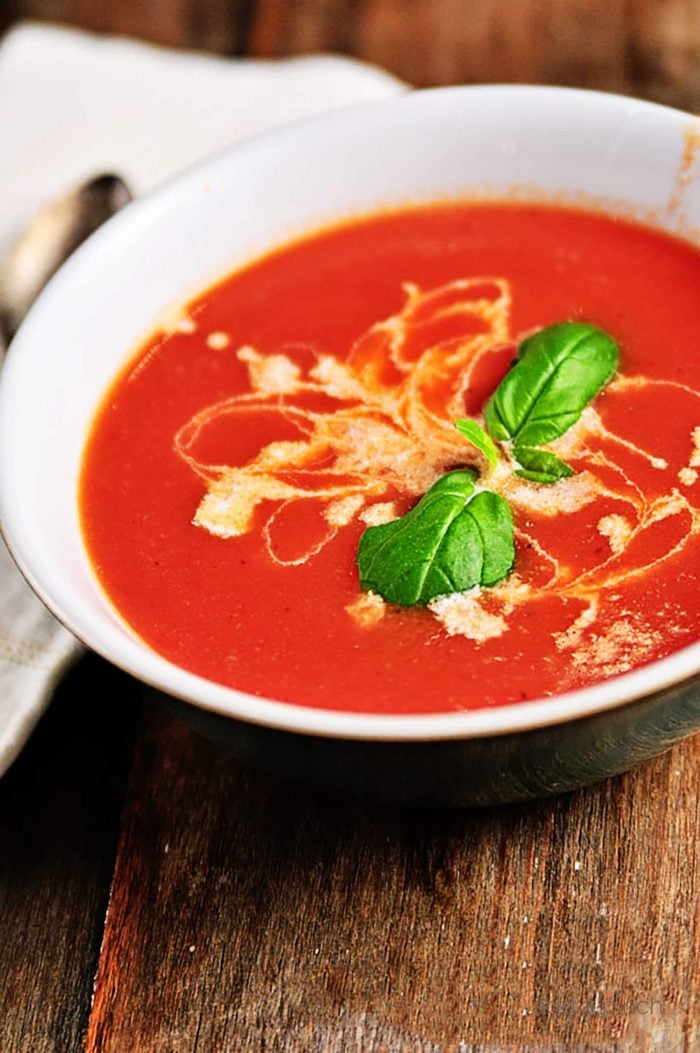 Tomato Soup Recipe - This fresh, homemade tomato soup comes together quickly for a delicious, comforting classic. Ready in 15 minutes!  // addapinch.com