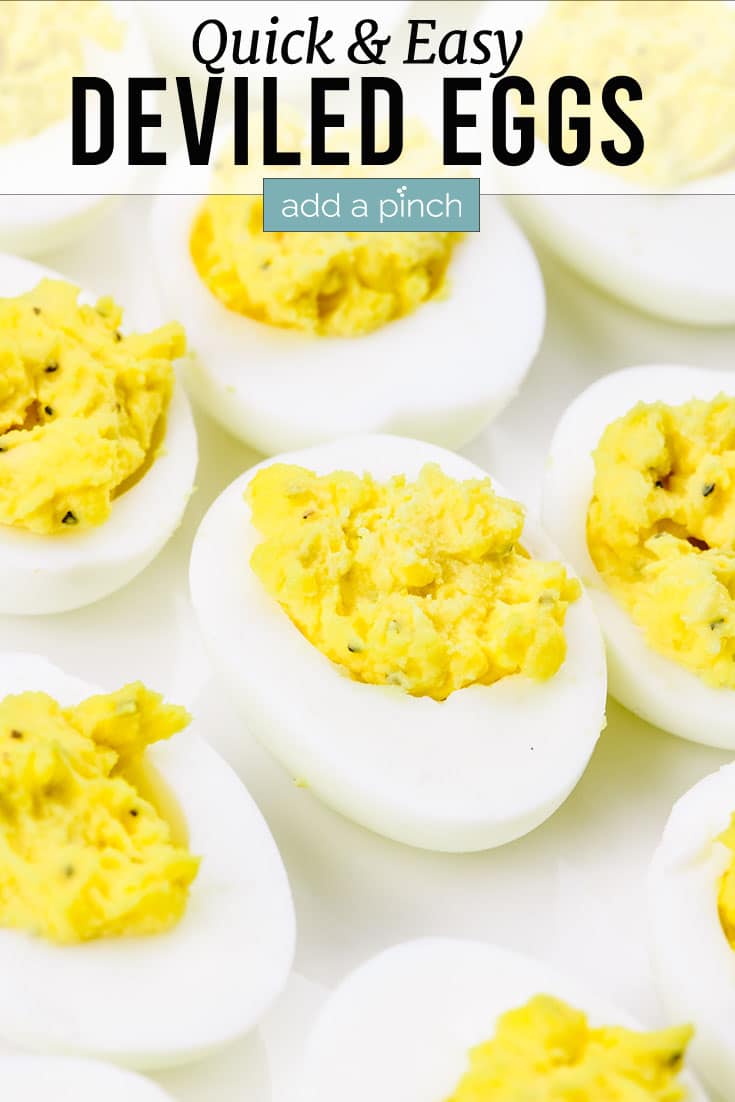 Deviled eggs on a white platter | addapinch.com