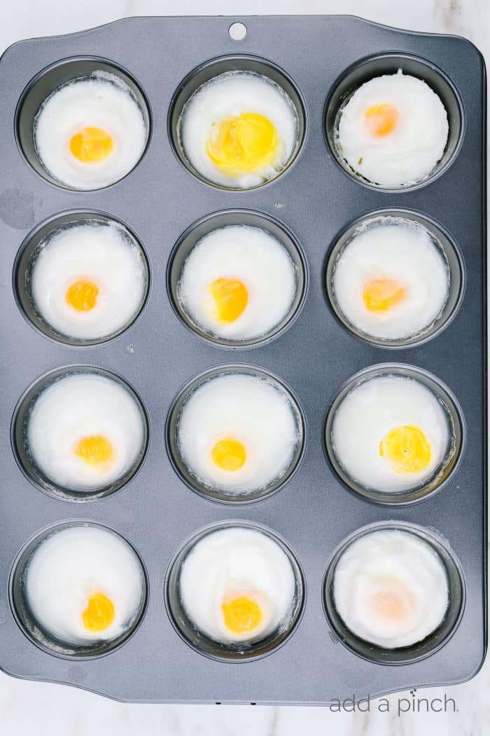 A muffin tin holds 12 baked eggs  // addapinch.com