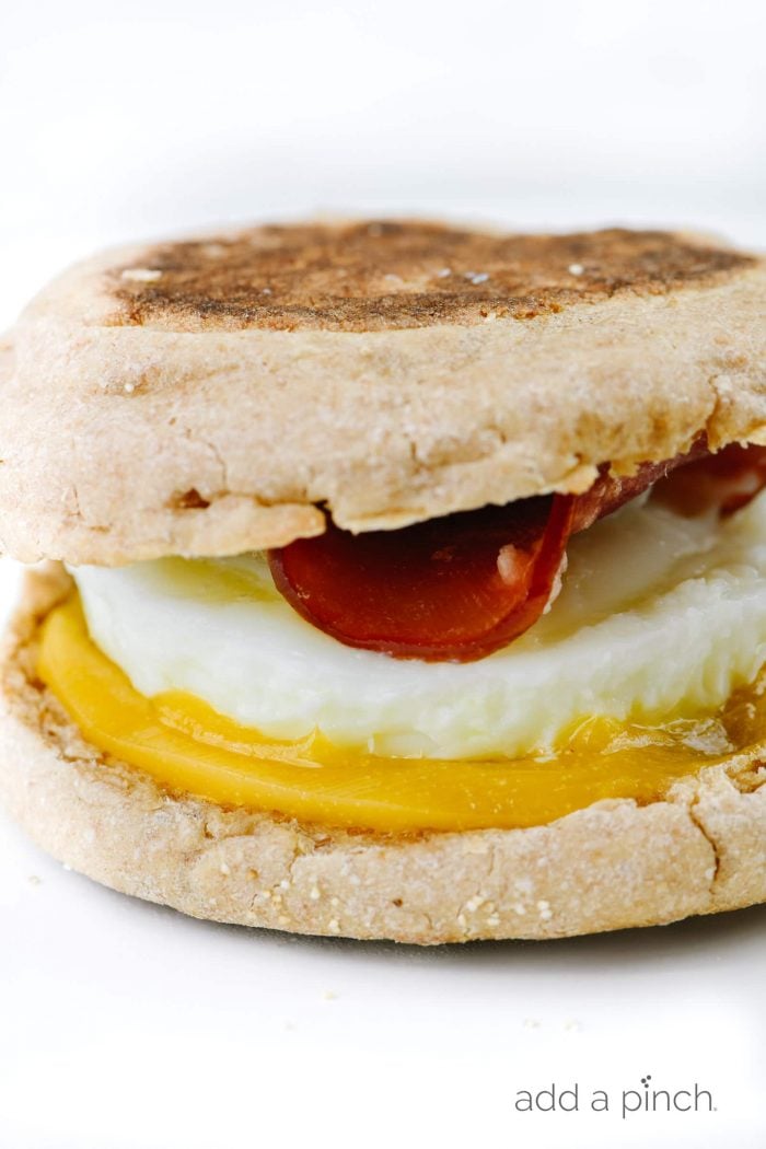 A homemade Egg McMuffin with English muffin, cheese, egg and Canadian bacon. // addapinch.com