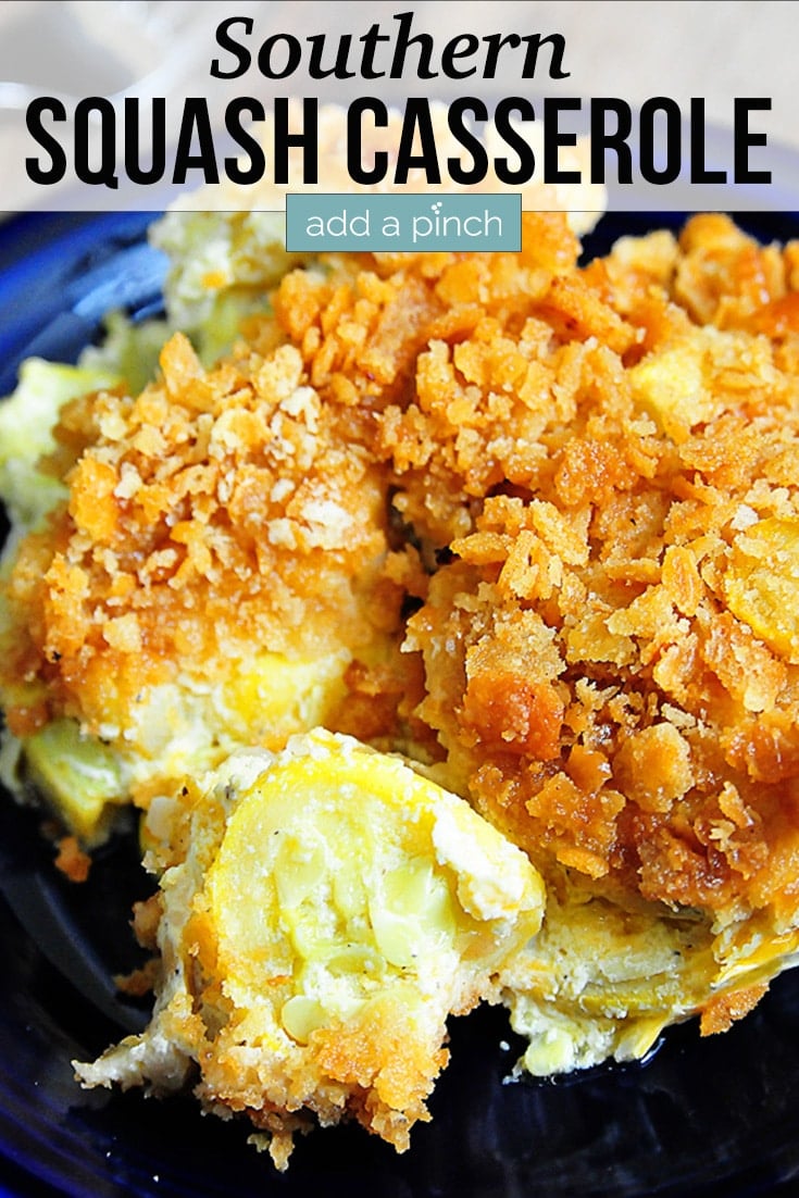 Squash Casserole with browned crunchy topping served on a blue plate - with text - addapinch.com
