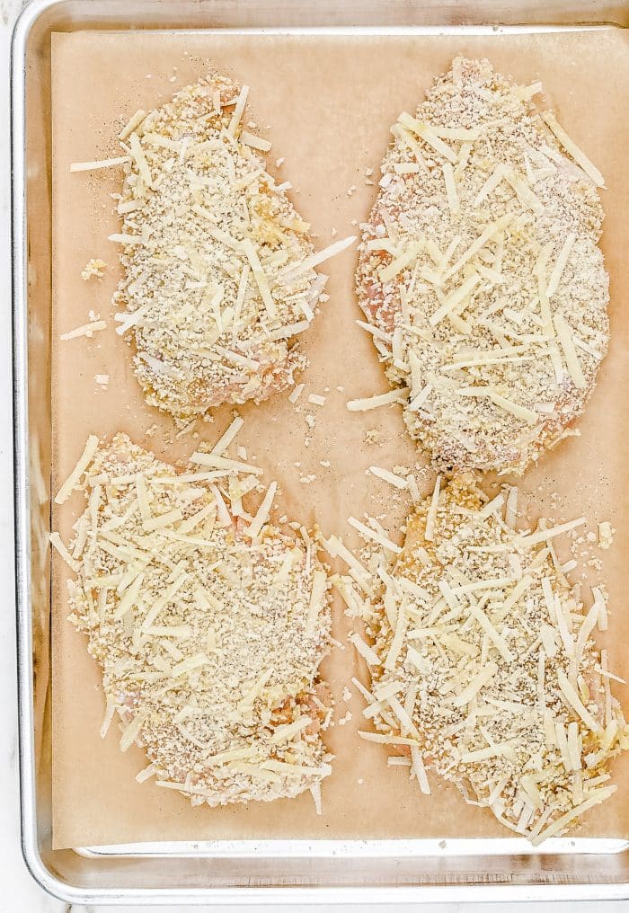 Chicken Parmesan Recipe - Crispy chicken is topped with marinara sauce, Parmesan and mozzarella cheeses for an easy, classic Italian favorite. Ready in 30 minutes! // addapinch.com