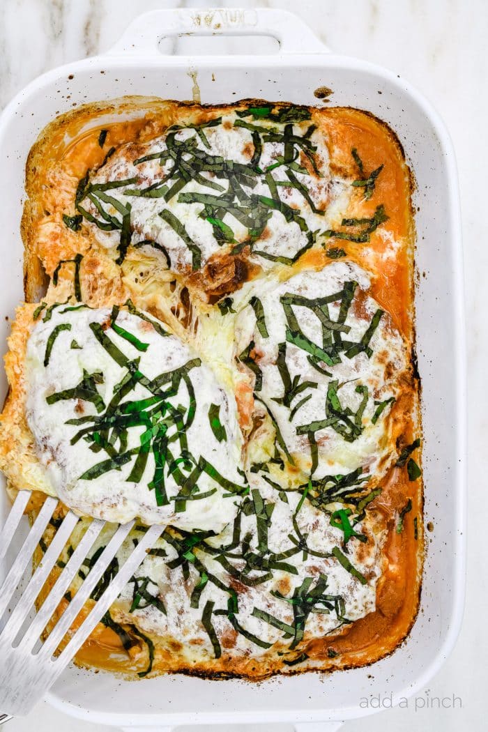 Chicken Parmesan Recipe - Crispy chicken is topped with marinara sauce, Parmesan and mozzarella cheeses for an easy, classic Italian favorite. Ready in 30 minutes! // addapinch.com