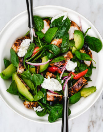 Grilled Chicken Salad with Strawberries and Avocado Recipe - This simple grilled chicken salad is made with fresh spinach, sweet berries and creamy avocado, then tossed with a quick balsamic dressing. Ready in 30 minutes! // addapinch.com
