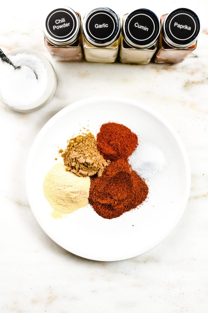 Homemade Taco Seasoning Recipe - This easy homemade taco seasoning mix is made with just five ingredients and with no preservatives! Great for tacos, fajitas, and so much more!  // addapinch.com