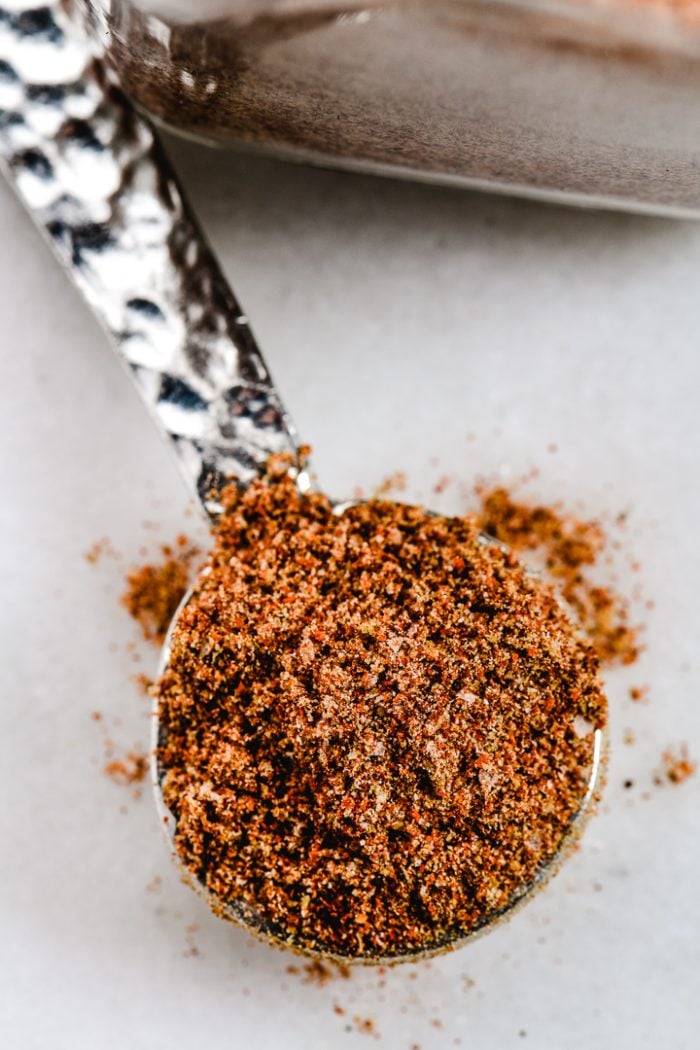 Hammered pewter measuring spoon holds blended taco seasoning. 