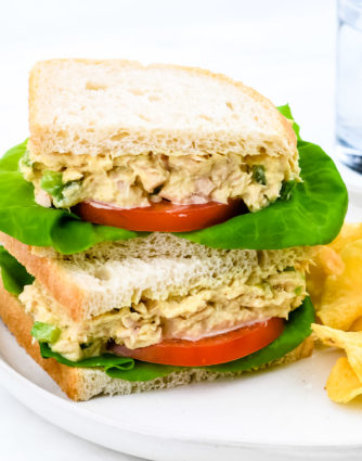 This tuna salad sandwich is so quick and easy and makes for a simple, yet scrumptious meal! Made with tuna, mayonnaise, and a few ingredients that make this the best tuna salad sandwich I've ever tasted! // addapinch.com