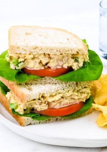 This tuna salad sandwich is so quick and easy and makes for a simple, yet scrumptious meal! Made with tuna, mayonnaise, and a few ingredients that make this the best tuna salad sandwich I've ever tasted! // addapinch.com