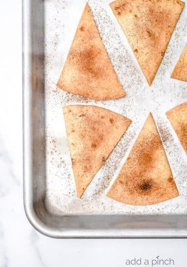 Cinnamon Sugar Tortilla Chips make a quick and easy recipe perfect for serving with your favorite sweet dips, salsa, or ice cream! Made with 4 ingredients and ready in minutes! // addapinch.com