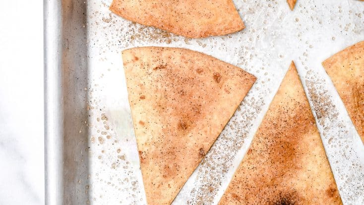 Cinnamon Sugar Tortilla Chips make a quick and easy recipe perfect for serving with your favorite sweet dips, salsa, or ice cream! Made with 4 ingredients and ready in minutes! // addapinch.com