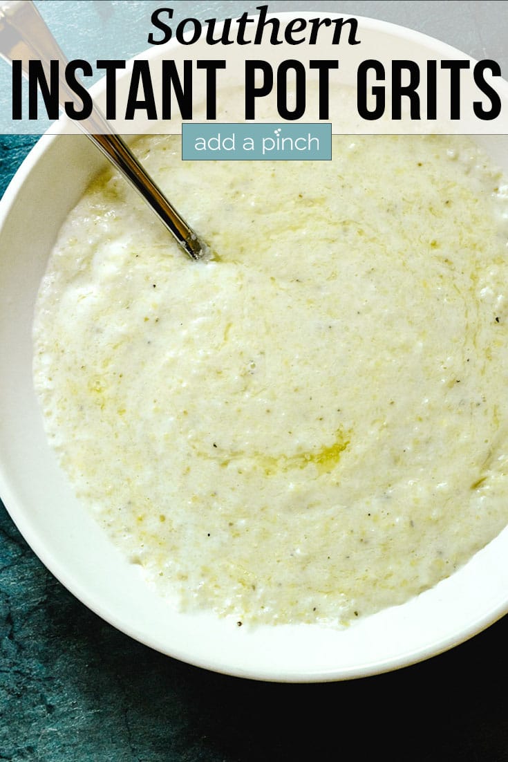 Instant Pot Grits with melted butter in bowl with spoon - with text - addapinch.com