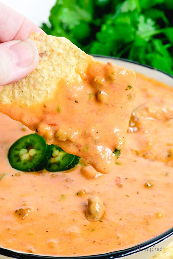 This Chili Cheese Dip makes the best quick and easy cheese dip! Made from scratch with just 6 ingredients and ready in minutes! It is always a favorite! // addapinch.com