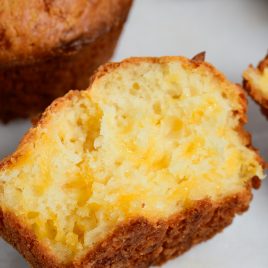 Easy Cheddar Cheese Muffins are so moist, tender and delicious! This cheesy bread is perfect for serving with soup, stew, BBQ or any meal! // addapinch.com