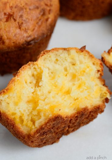 Easy Cheddar Cheese Muffins are so moist, tender and delicious! This cheesy bread is perfect for serving with soup, stew, BBQ or any meal! // addapinch.com