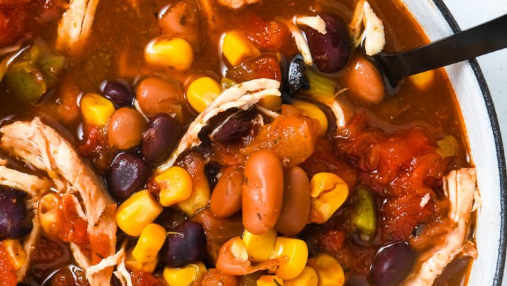 Chicken Taco Soup Recipe - So quick and easy, this chicken taco soup recipe is flavorful and delicious! Made with chicken, beans, corn, it is on the table in less than 30 minutes! // addapinch.com