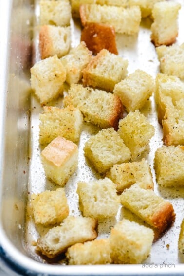 Learn how to make easy homemade croutons from scratch with this simple croutons recipe. The make the perfect for topping salads, soups and more! // addapinch.com
