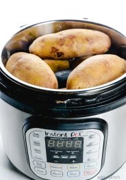 Instant Pot "Baked" Potatoes make a quick and easy way to prepare baked potatoes! Ready in less than 30 minutes! // addapinch.com