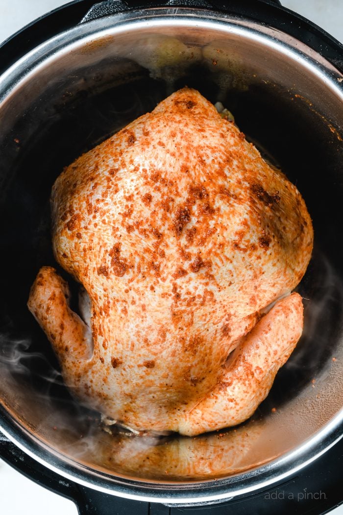 Learn how to make rotisserie chicken in your Instant Pot for tender, mouth-wateringly delicious rotisserie-style chicken every time! // addapinch.com