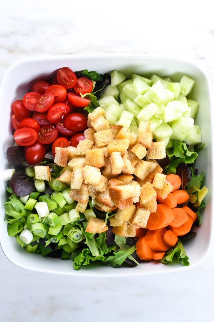 This simple salad recipe makes the best house salad that goes with anything! Made with simple greens and add-ins, this is the side salad of all side salad recipes!  // addapinch.com