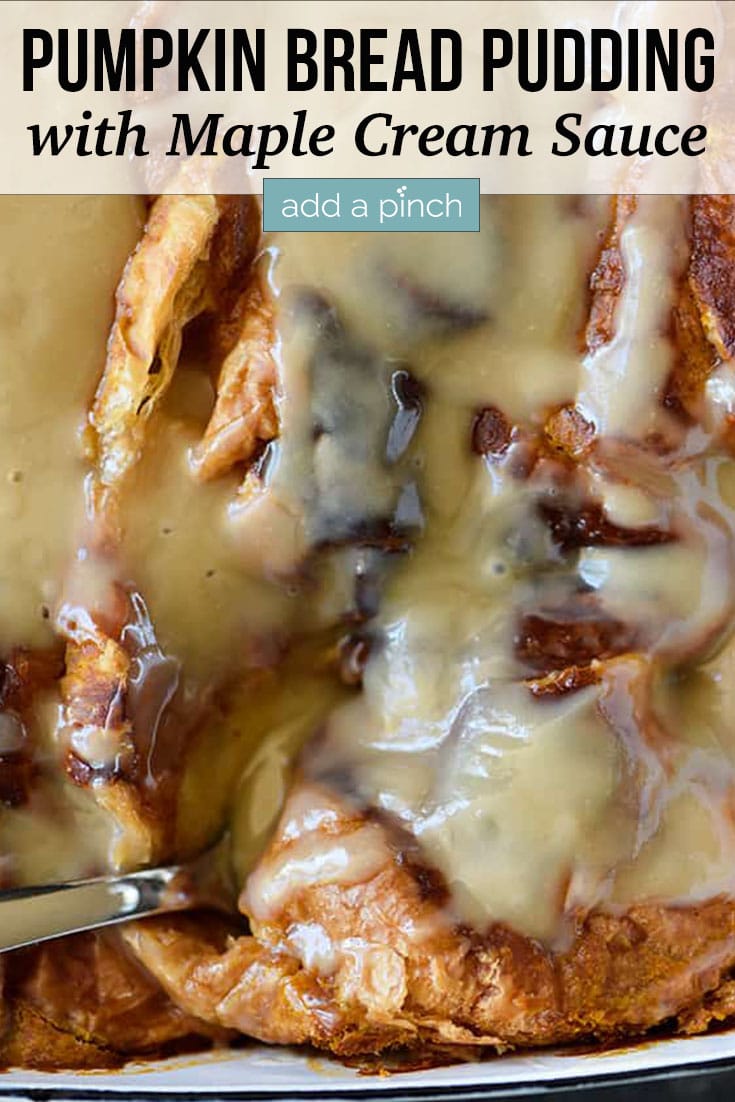 Pumpkin Bread Pudding drizzled with Maple Cream Sauce being dipped out with a spoon - with text - addapinch.com