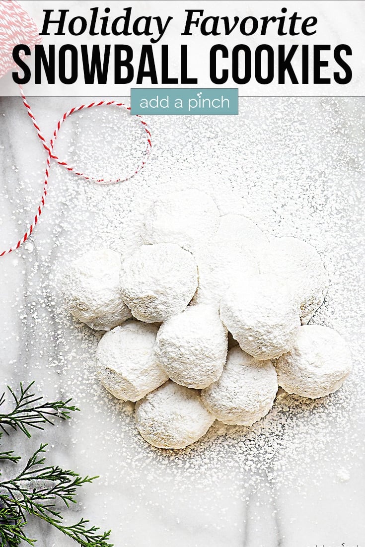 Stack of Snowball Cookies on marble board - with text - addapinch.com