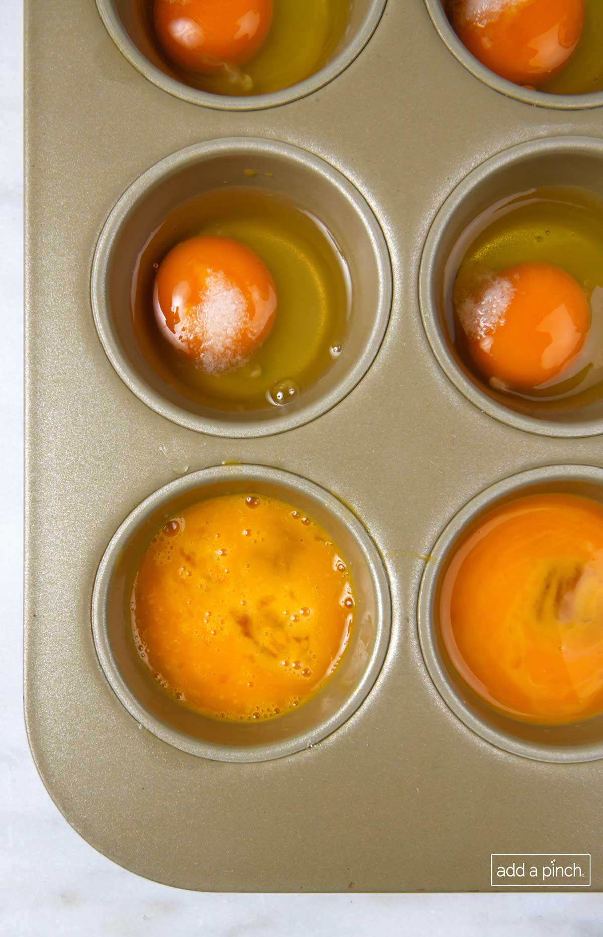 Photo of eggs in a muffin pan.