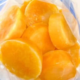 Photograph of frozen eggs in a freezer safe bag to demonstrate how to freeze fresh eggs. / addapinch.com