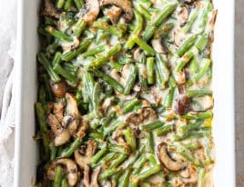 Green bean casserole in a white baking dish ready to be baked.