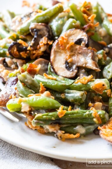 Photo of green bean casserole on a white plate.
