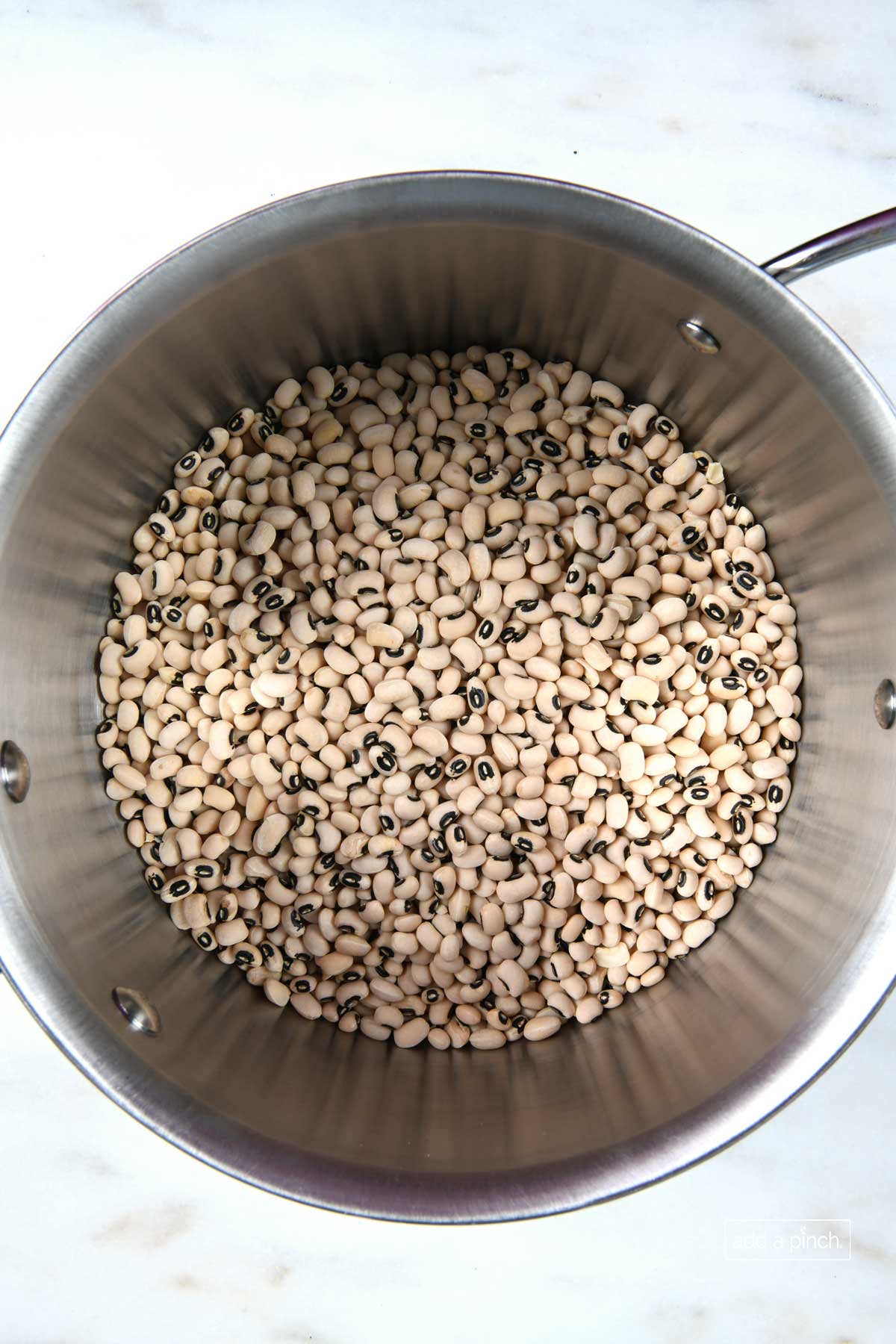 Photo of rinsed black eyed peas in a saucepan ready to soak. 