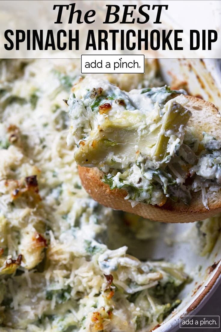 Closeup of hot spinach artichoke dip being spooned from baking dish - with text - addapinch.com