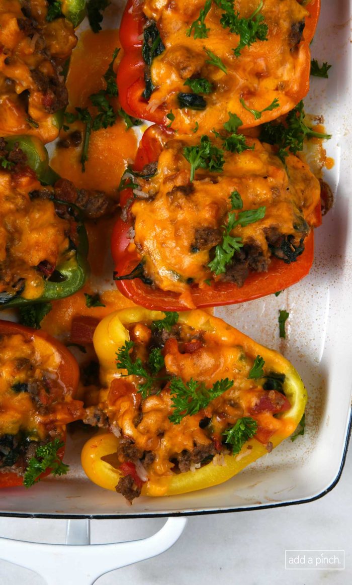 Photo of stuffed peppers in a baking dish.
