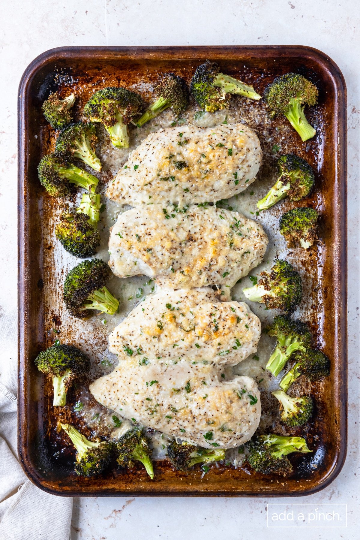 Photo of easy parmesan crusted chicken sheet pan dinner.