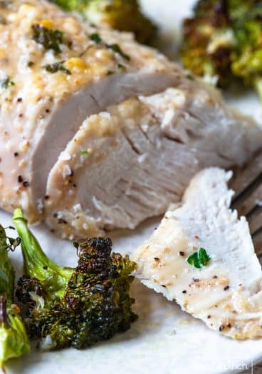 Photo of parmesan crusted chicken dinner with broccoli.