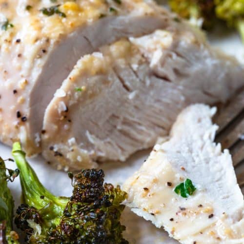 Photo of parmesan crusted chicken dinner with broccoli.