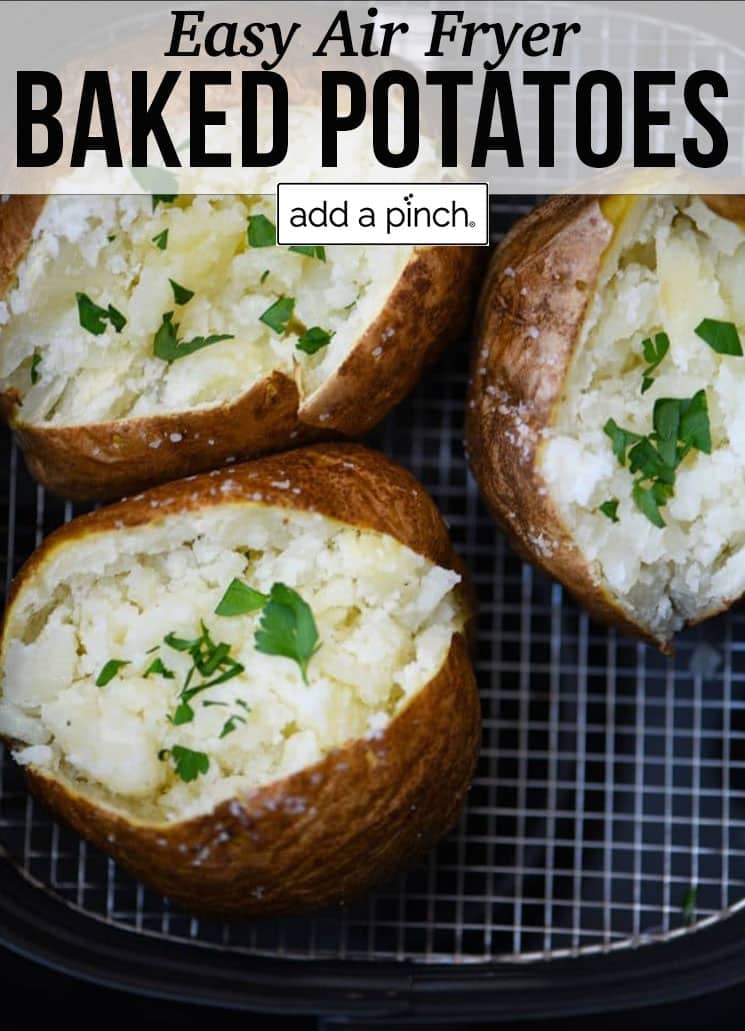 Air fryer tray with three fluffy baked potatoes topped with butter and herbs - with text - addapinch.com