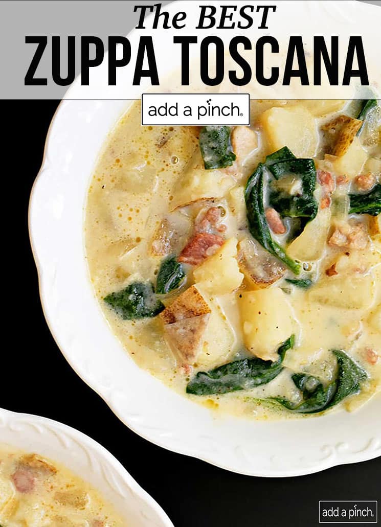 Two white bowls of zuppa toscana soup with potatoes, spinach and meat - with text - addapinch.com