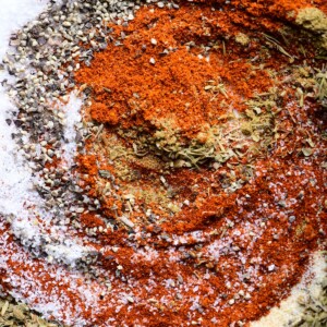 Photograph of ingredients for blackened seasoning in a white dish