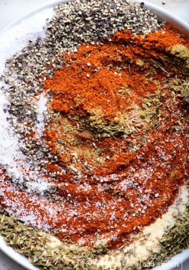 Photograph of ingredients for blackened seasoning in a white dish