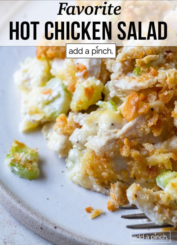 Plate of hot chicken salad with buttery cracker topping - with text - addapinch.com