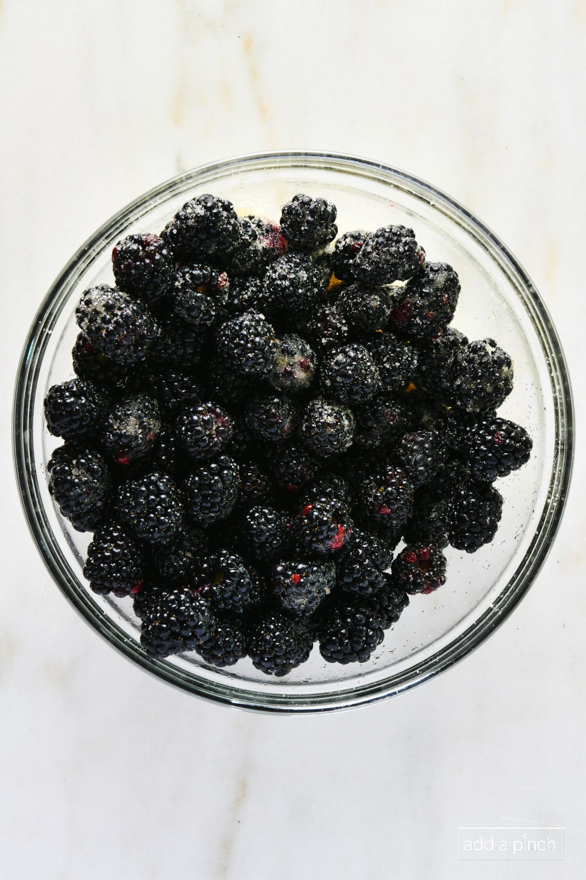 Sugared blackberries in a glass bowl
