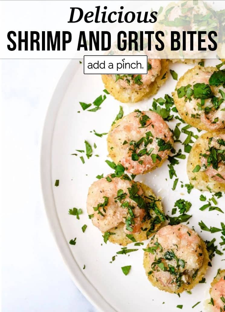 Small bite sized appetizers made from grits and shrimp with garnish of herbs - with text - addapinch.com