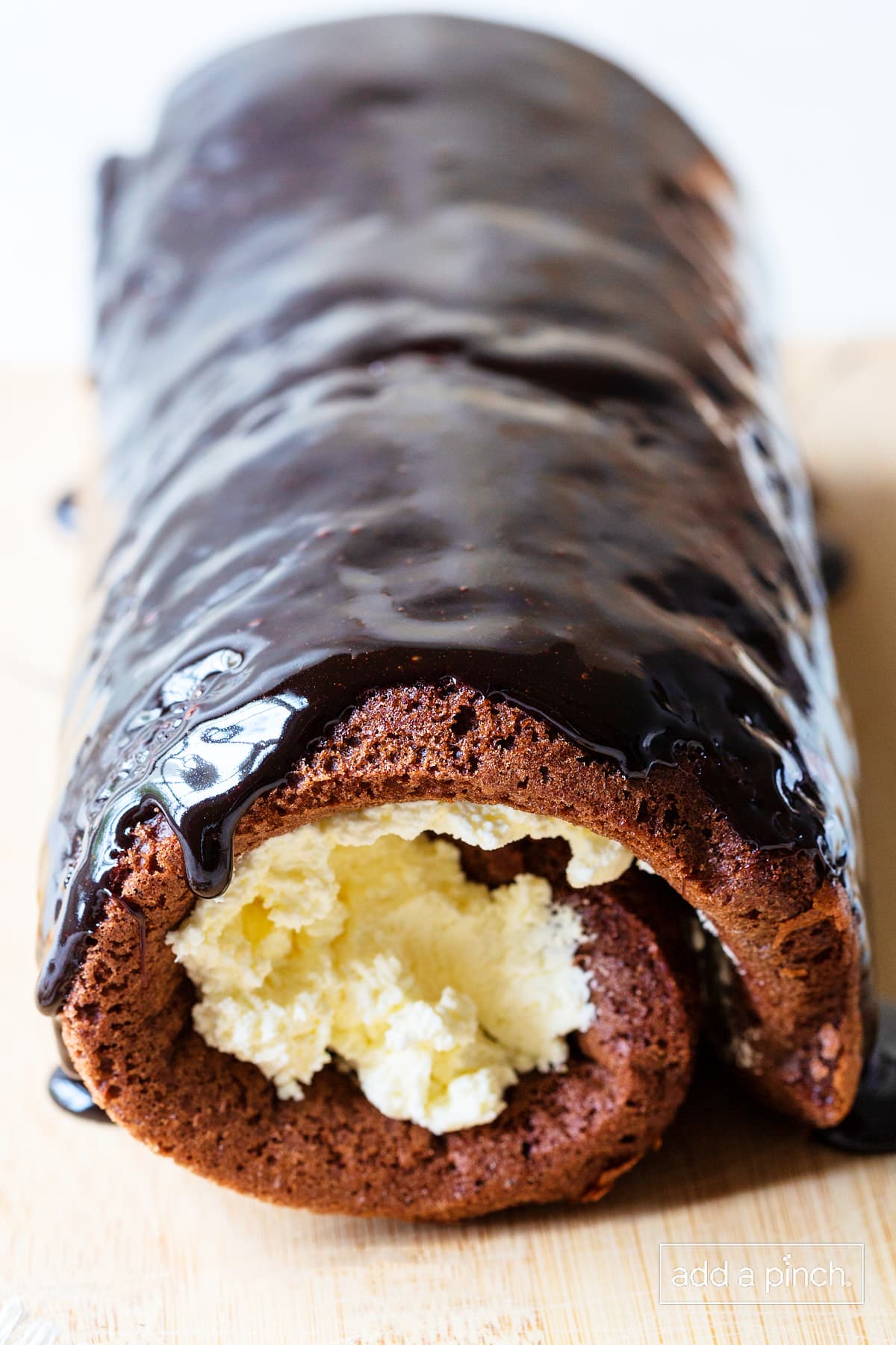 Chocolate cake roll with ganache frosting.